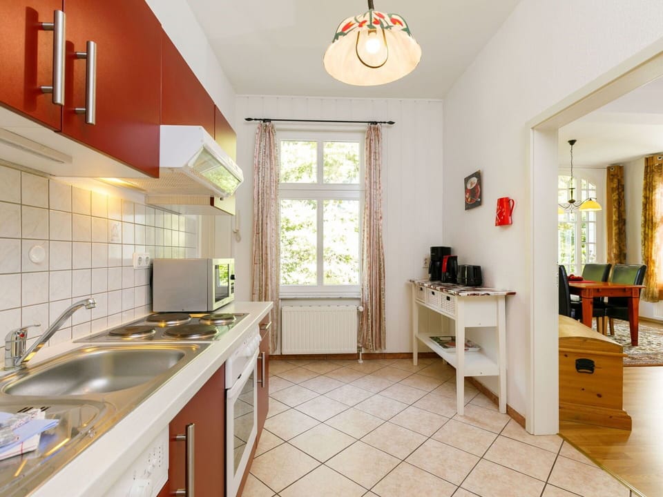 Furniture, Cabinetry, Sink, Kitchen Sink, Table, Countertop, Wood, Interior Design, Lighting, Orange