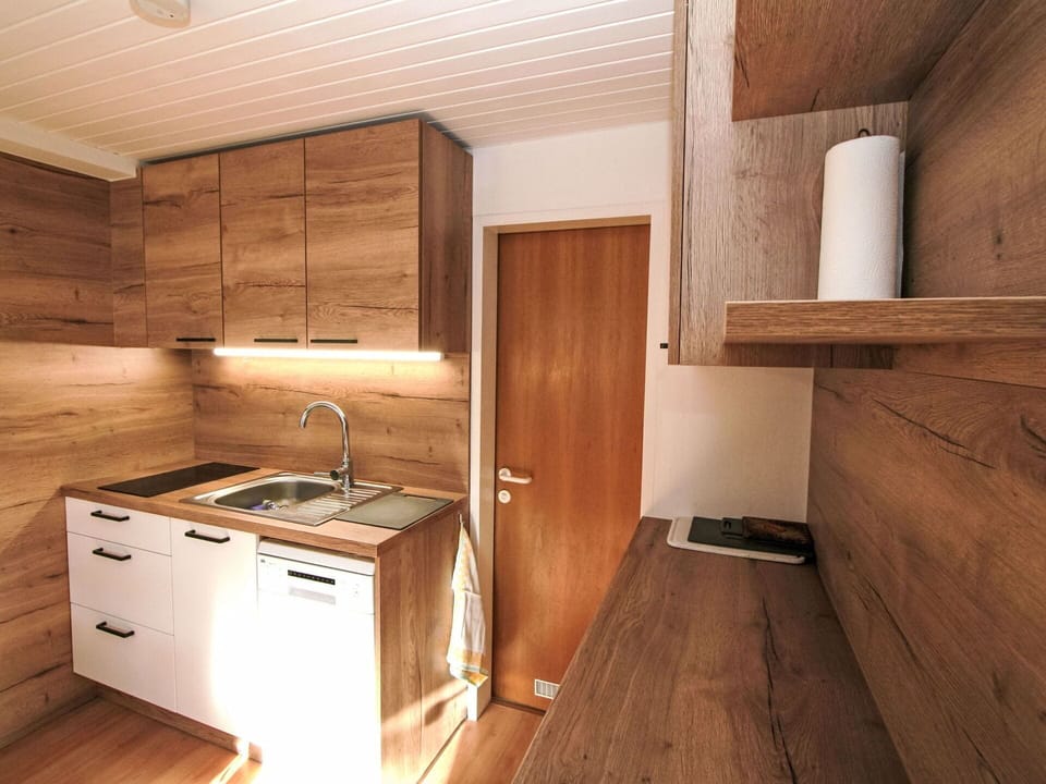 Flooring, Wood, Floor, Wood Flooring, Interior Design, Furniture, Countertop, Cabinetry, Wood Stain, Brown