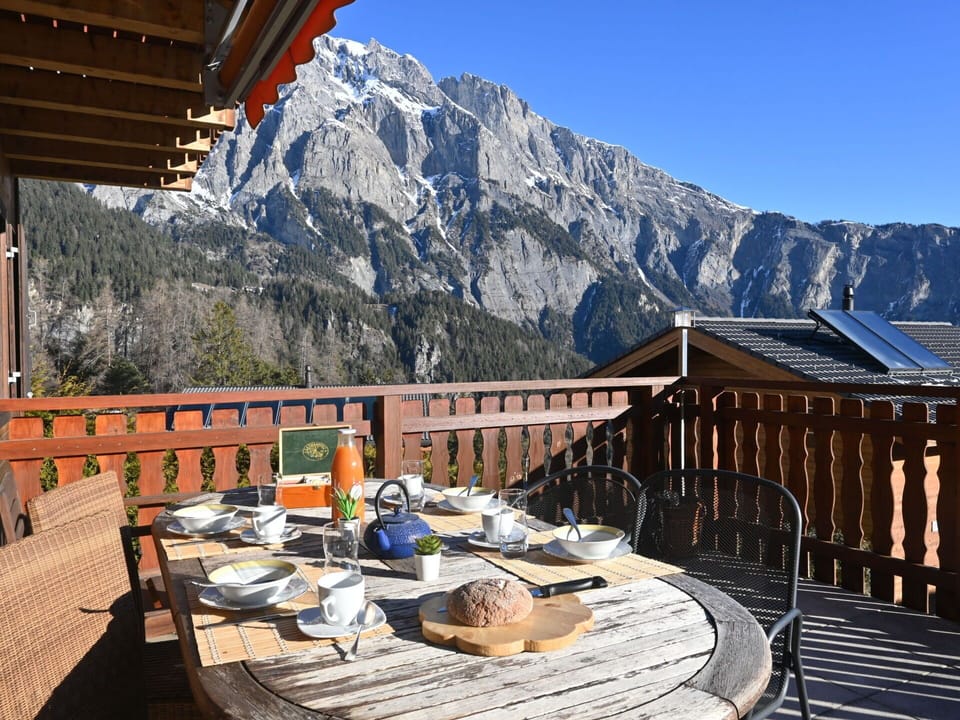 Sky, Property, Mountain, Building, Cloud, Nature, Table, Wood, Architecture, Outdoor Furniture