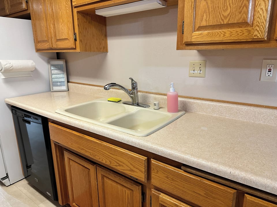 Kitchen - Refrigerator, dishwasher, cooking utensils, pots, pans, plates, etc.