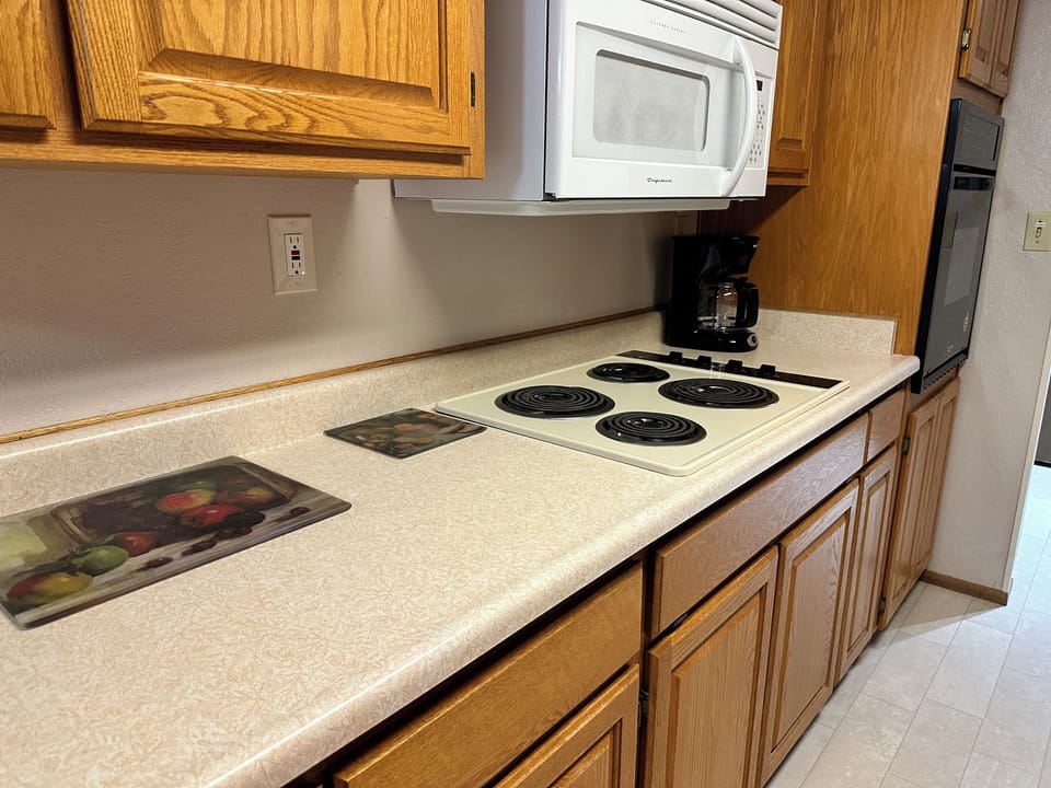 Kitchen - 4 burner electric stove, oven, microwave