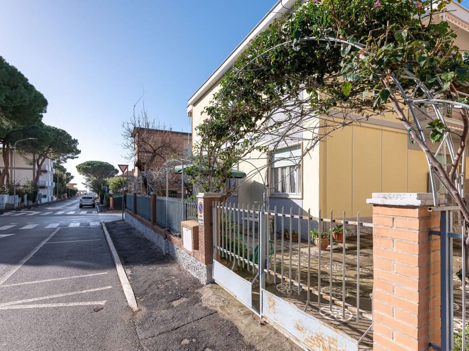 Property, Building, Plant, Sky, Road Surface, Fence, Tree, Architecture, Urban Design, House