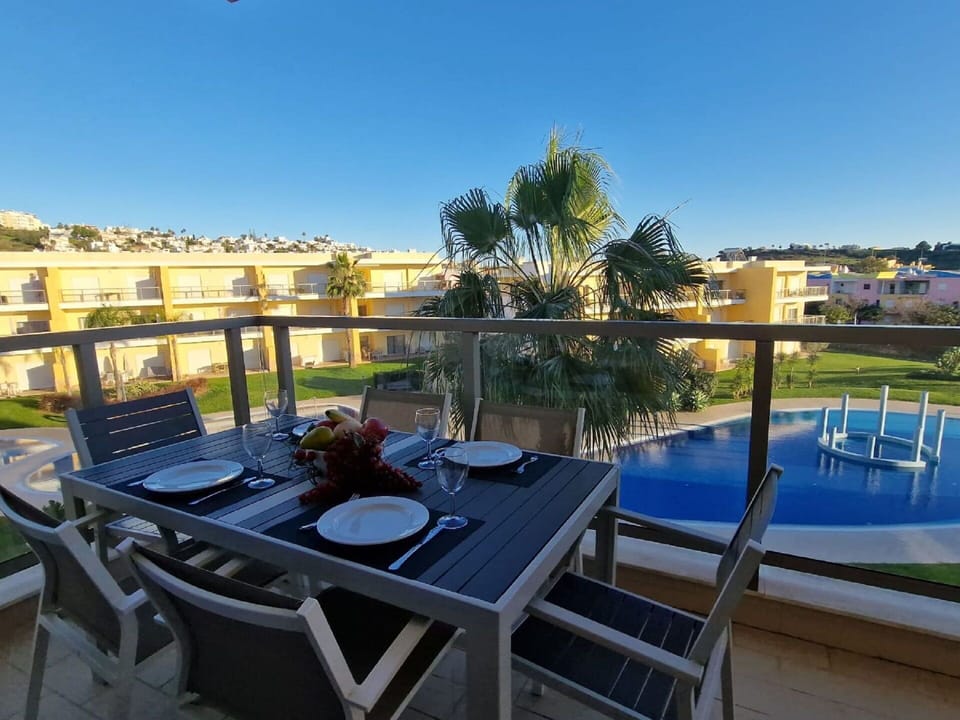 Sky, Table, Daytime, Furniture, Property, Cloud, Nature, Chair, Building, Outdoor Furniture
