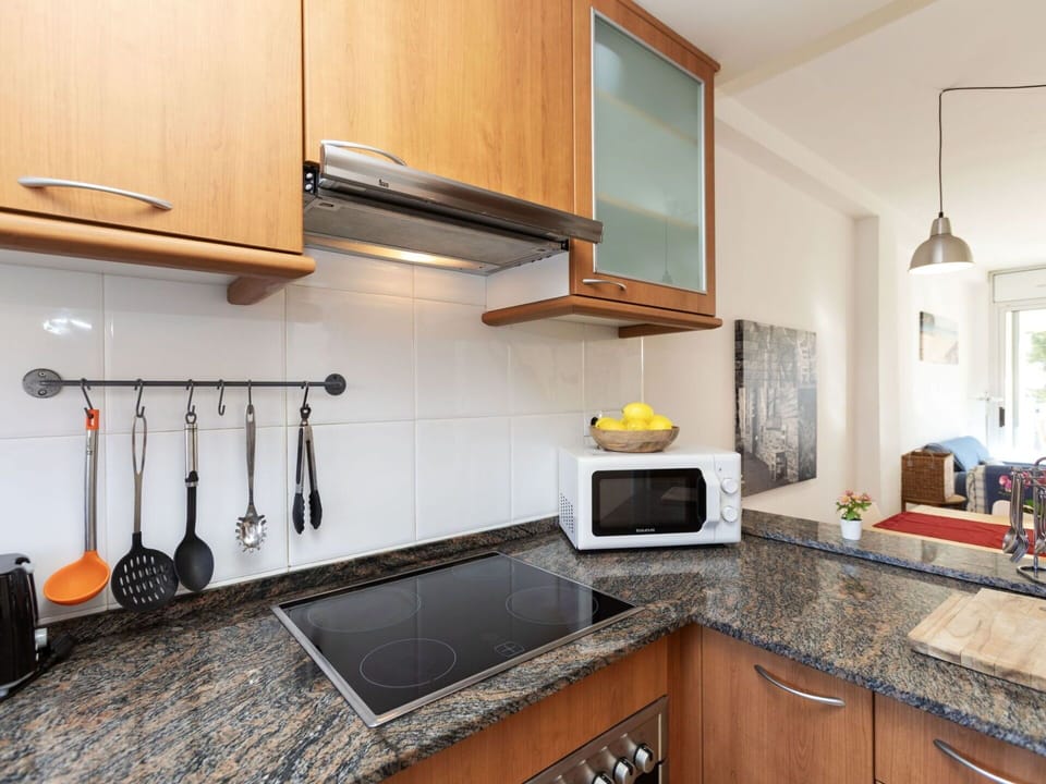 Cabinetry, Property, Countertop, Kitchen, Kitchen Stove, Wood, Kitchen Appliance, Lighting, Interior Design, Flooring