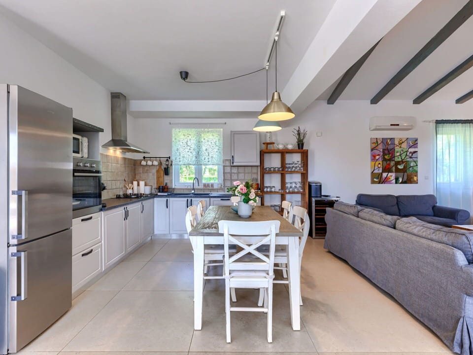 Furniture, Table, Property, Cabinetry, Countertop, Couch, Interior Design, Lighting, Houseplant, Wood
