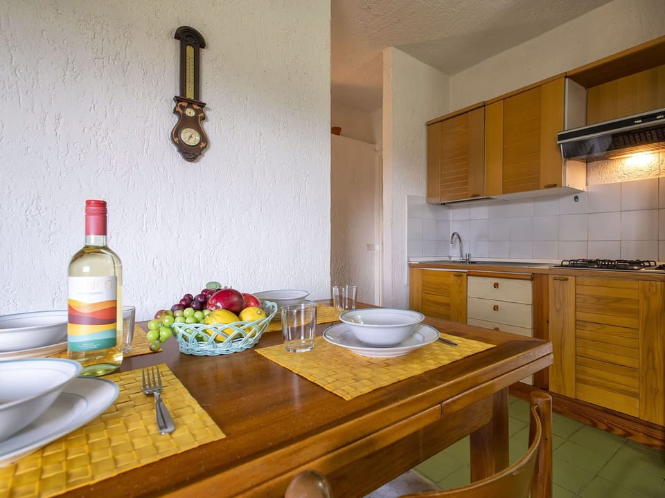 Furniture, Table, Cabinetry, Bottle, Tableware, Countertop, Wood, Interior Design, Kitchen, Drinkware