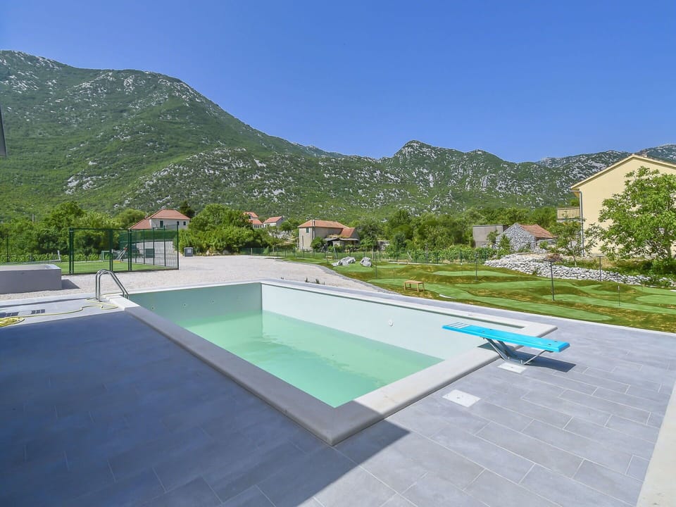 Sky, Water, Plant, Swimming Pool, Building, Azure, Outdoor Furniture, Land Lot, Shade, House