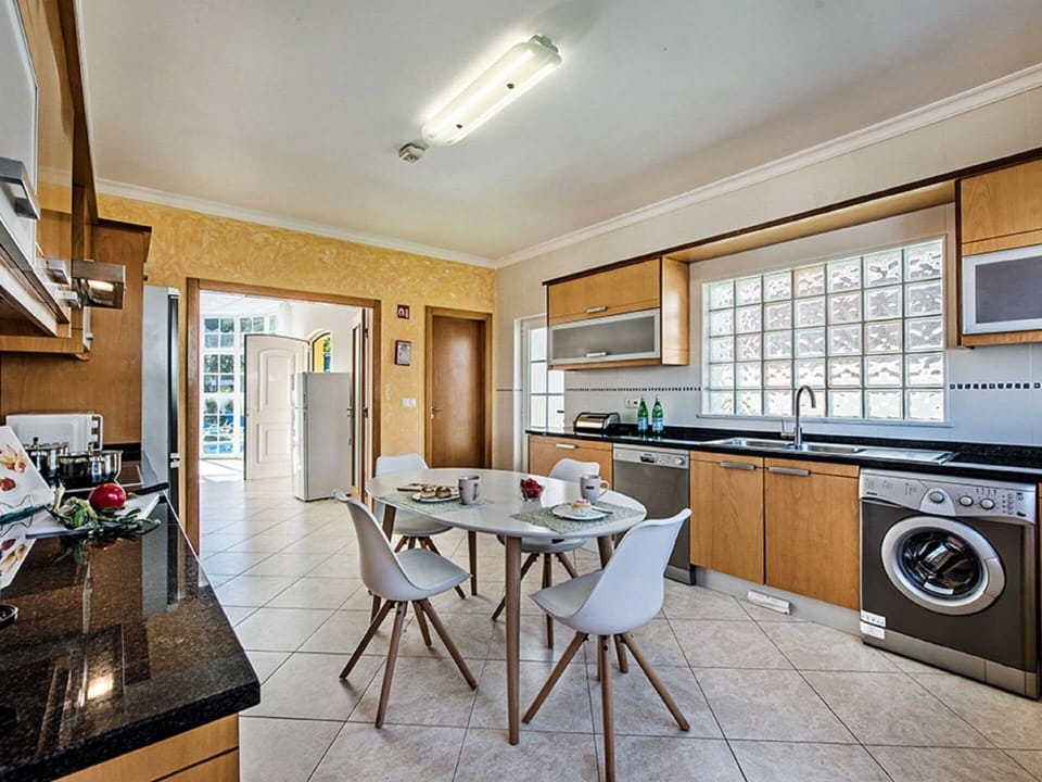 Furniture, Cabinetry, Countertop, Table, Wood, Kitchen, Interior Design, Kitchen Appliance, Chair, Kitchen Stove