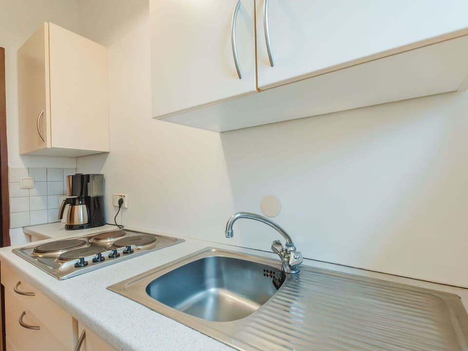 Tap, Kitchen Sink, Sink, Countertop, Plumbing Fixture, Property, Cabinetry, Wood, Interior Design, Kitchen