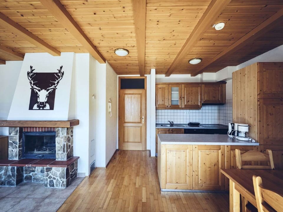 Property, Cabinetry, Wood, Architecture, Interior Design, Living Room, Floor, Wood Stain, Flooring, Beam