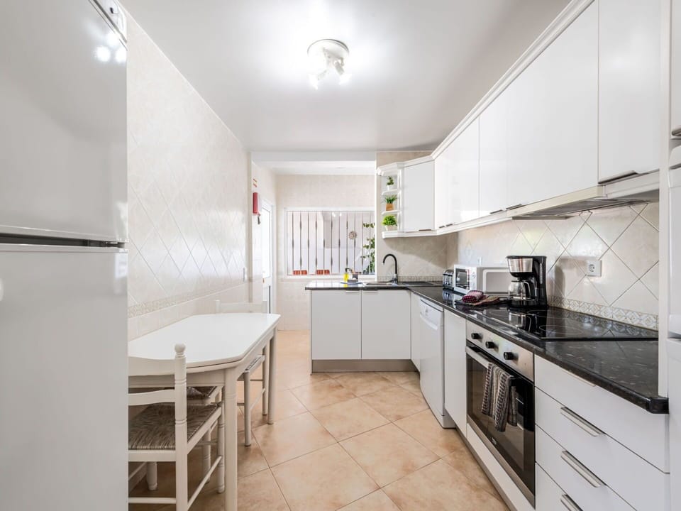 Kitchen, Flooring, Interior Design, Kitchen Appliance, Major Appliance, Floor, Countertop, Ceiling, Furniture, Cabinetry