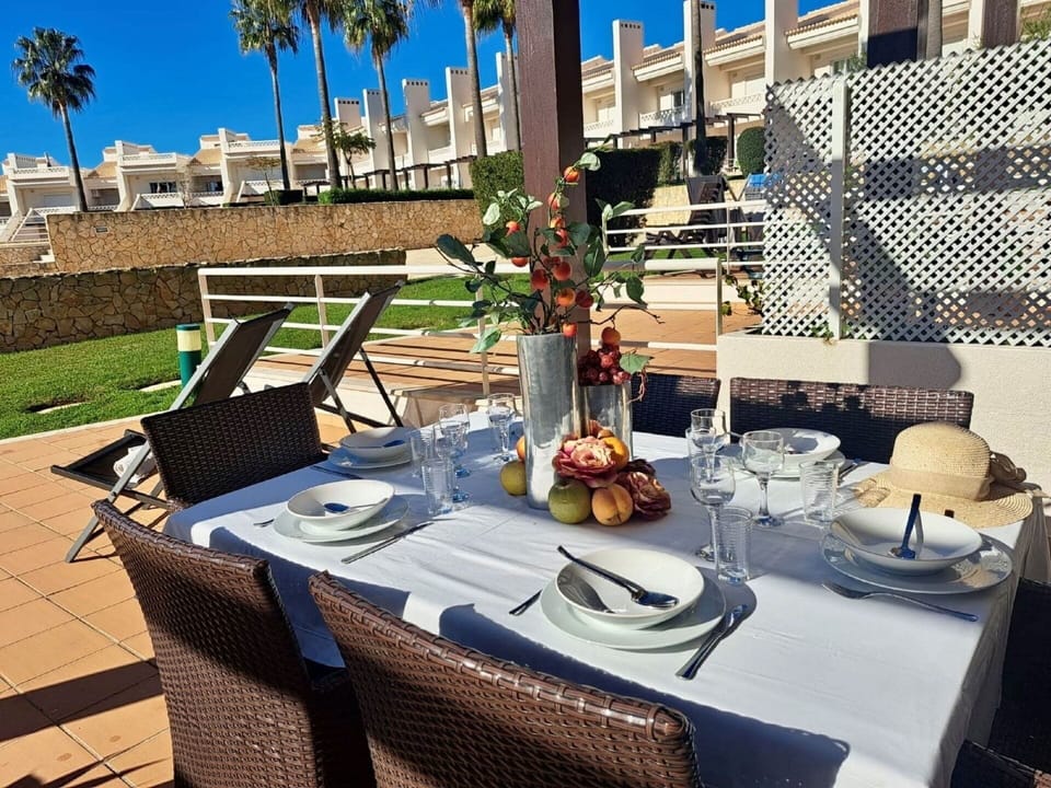 Table, Tableware, Furniture, Chair, Outdoor Table, Outdoor Furniture, Dishware, Flowerpot, Interior Design, Sky