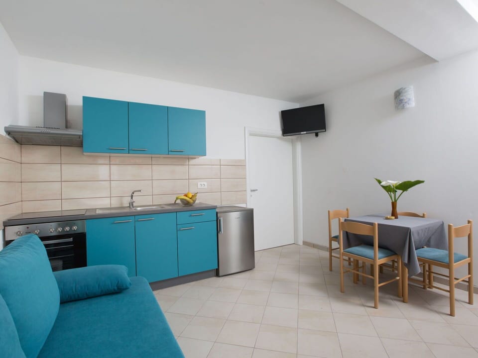 Cabinetry, Furniture, Countertop, Sink, Tap, Building, Plant, Houseplant, Chair, Drawer