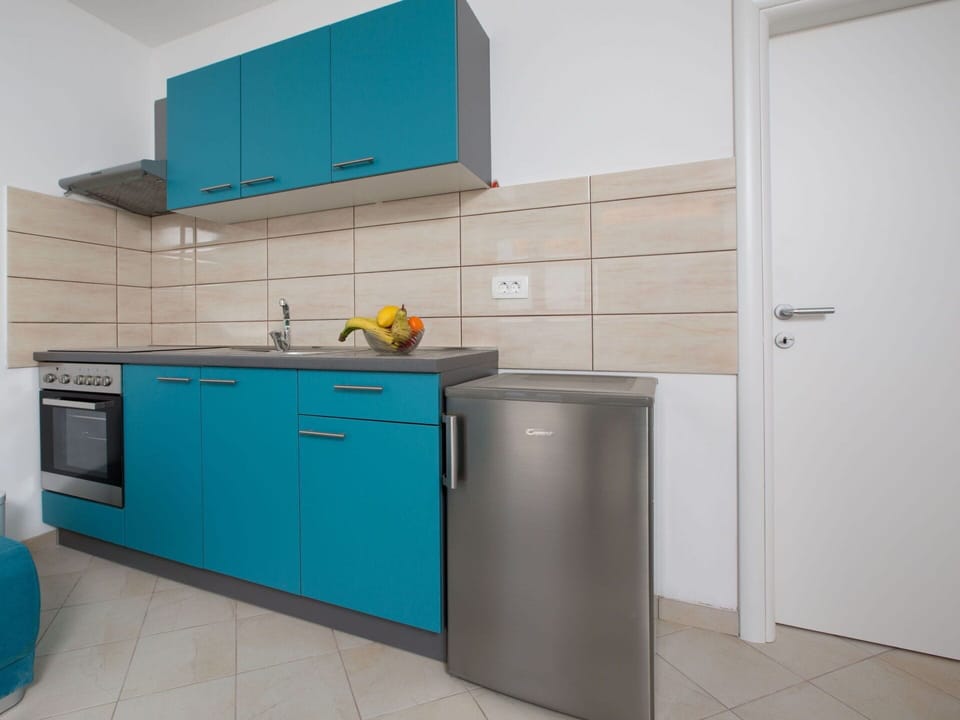 Building, Cabinetry, Property, Kitchen Appliance, Blue, House, Home Appliance, Kitchen, Interior Design