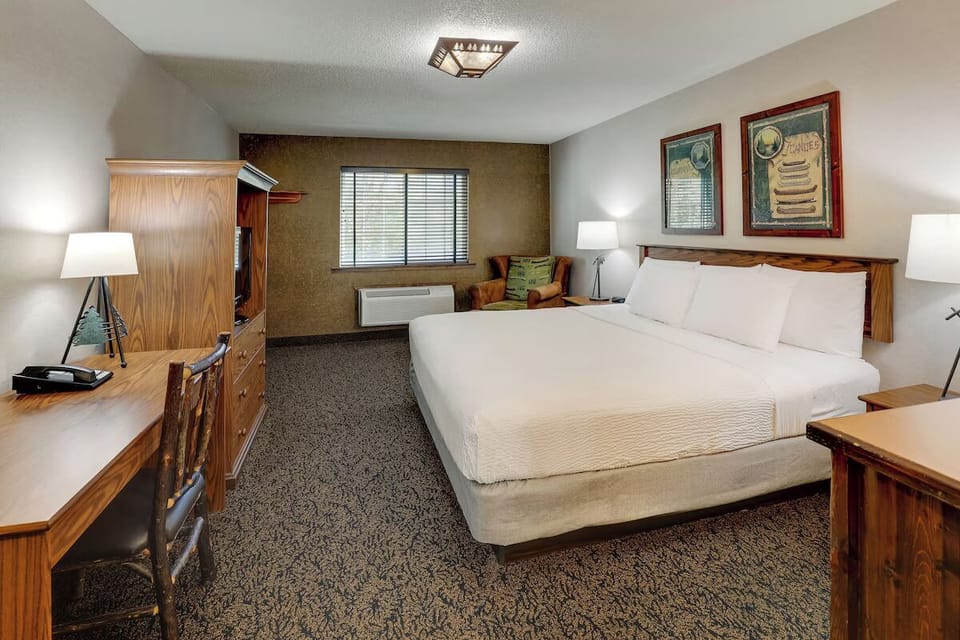 Stretch out in a spacious king room with warm lighting.