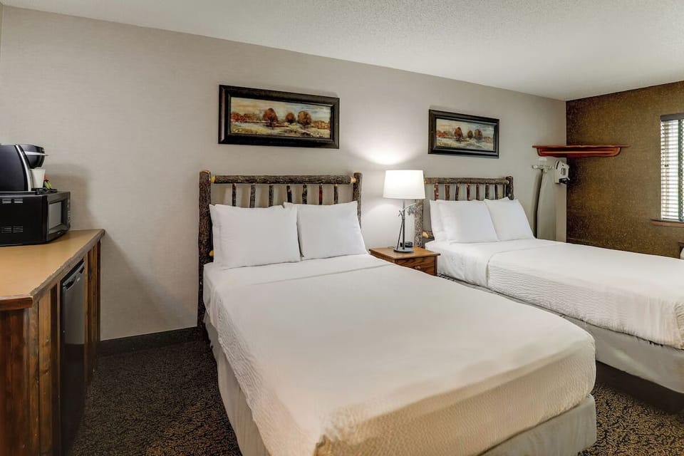 Drift off easily in two inviting beds with soft pillows.