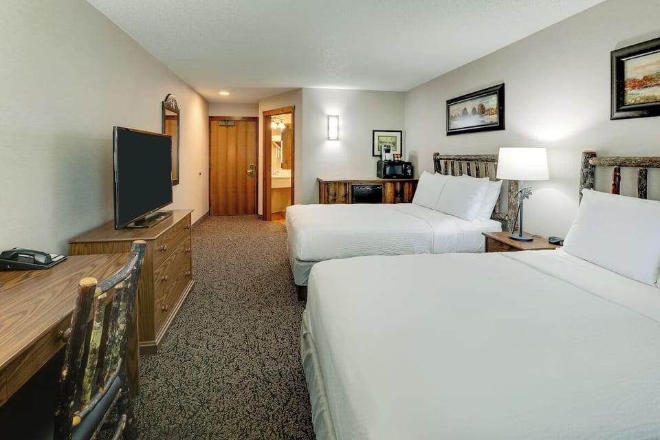 Relax in a bright double-queen room with simple comforts.