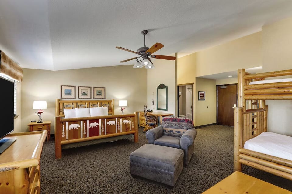 Unwind together in a spacious suite with rustic bunk beds.