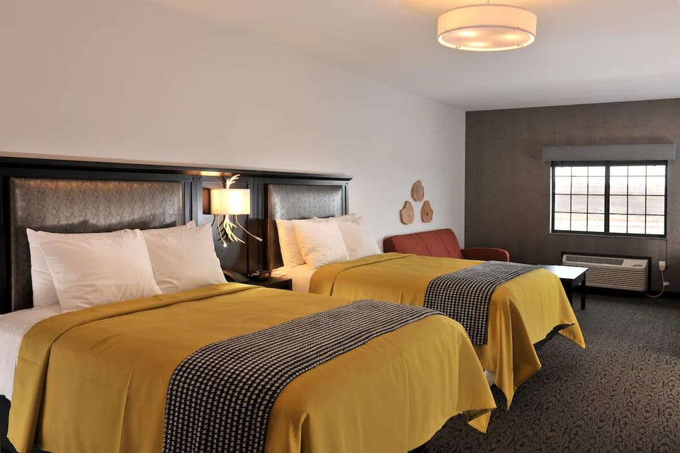 Wake up refreshed in a bright room with two comfy beds.
