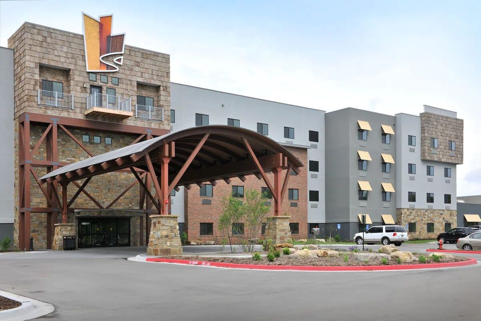 Arrive in style beneath the grand covered entrance canopy.