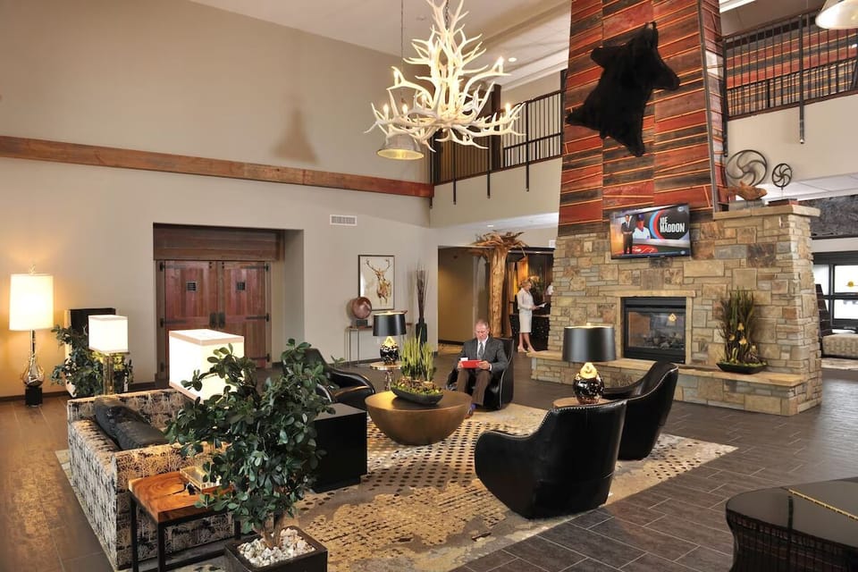 Settle in by the stone fireplace for a cozy welcome.