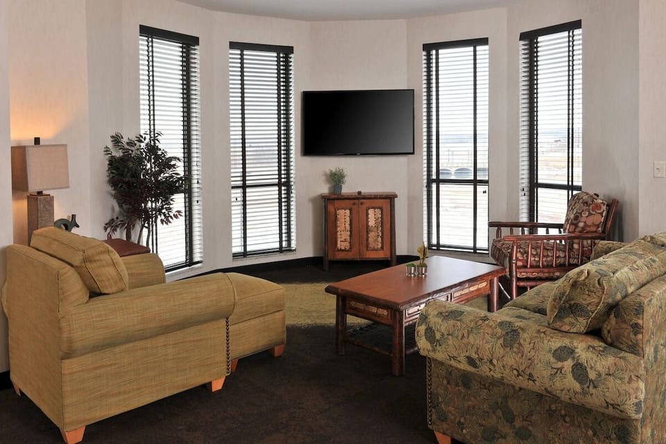 Relax by tall windows and enjoy a bright, airy lounge.