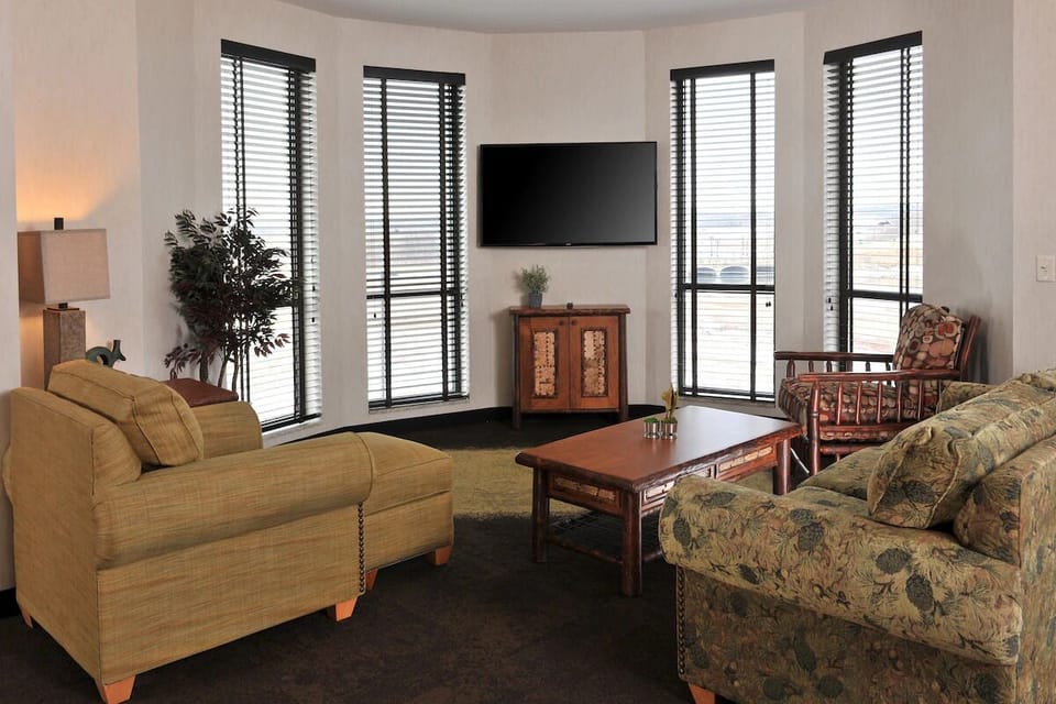 Relax by tall windows and enjoy a bright, airy lounge.