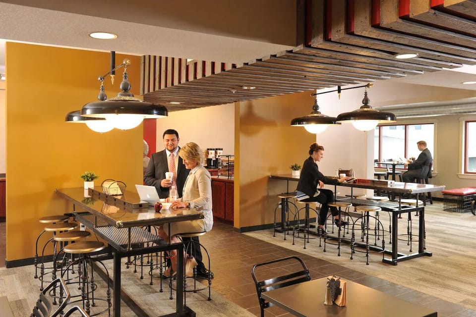 Catch up over snacks at the communal high-top tables.