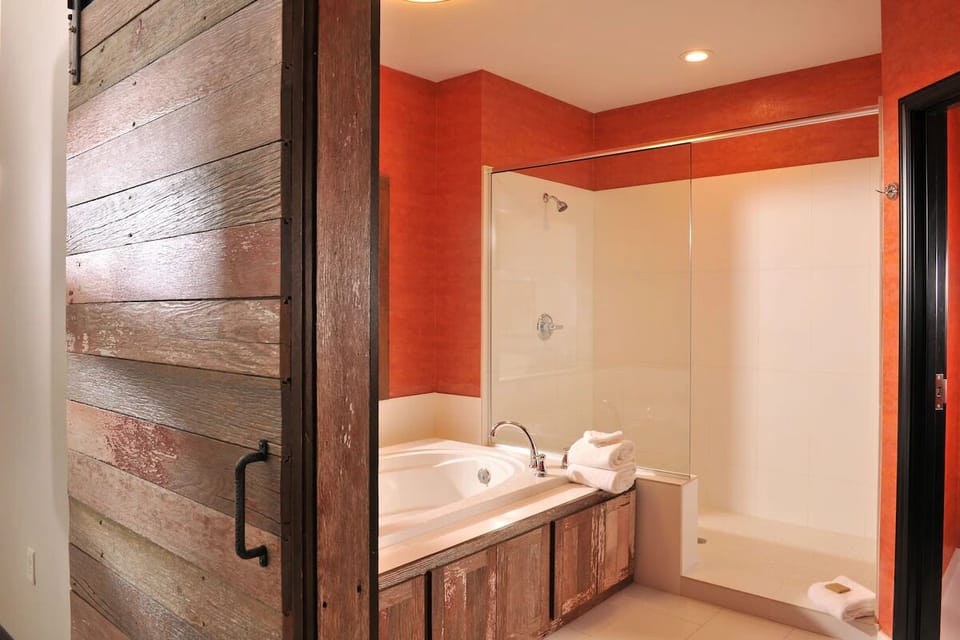 Rinse off comfortably with a glass shower and relaxing tub.