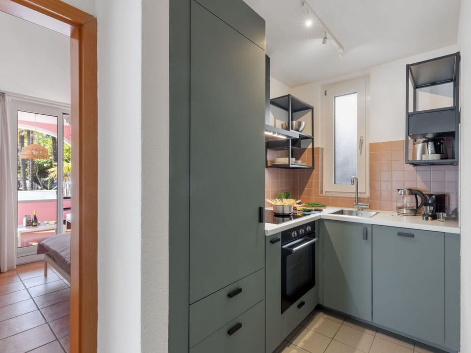 Cabinetry, Countertop, Furniture, Building, Wood, Interior Design, Kitchen, Flooring, Kitchen Stove, Kitchen Appliance