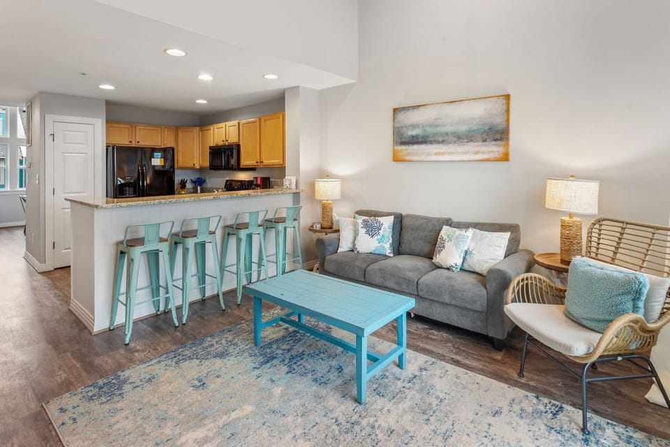 The spacious Living Area with the adjacent Kitchen is great for relaxing after a long day at the beach!