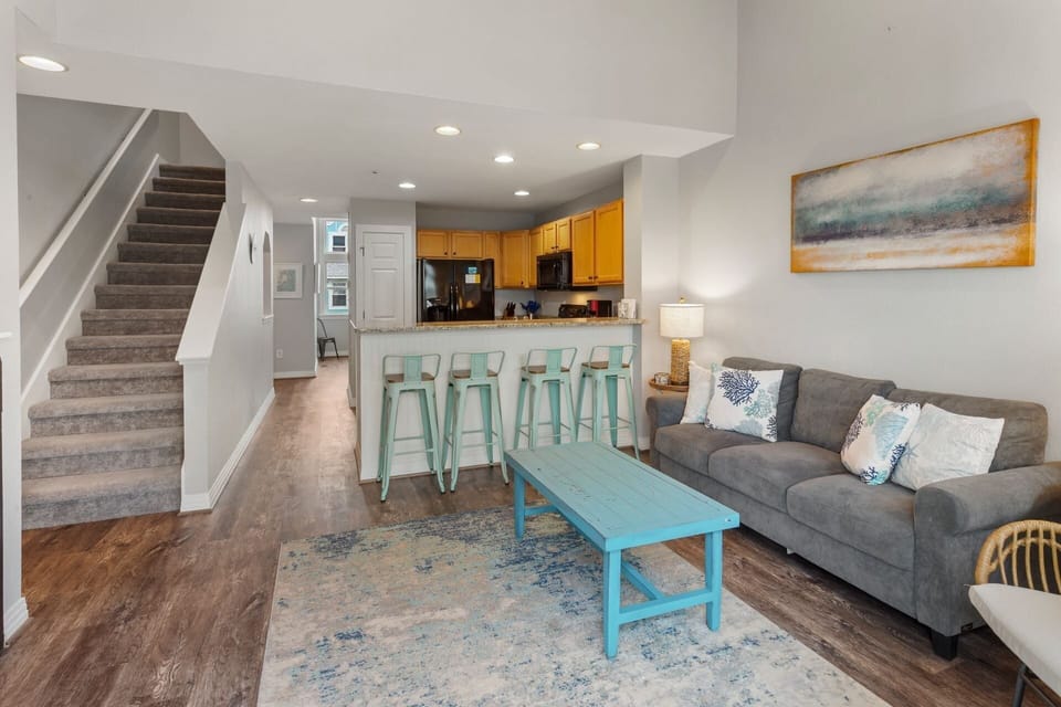 The spacious Living Area with the adjacent Kitchen is great for relaxing after a long day at the beach!