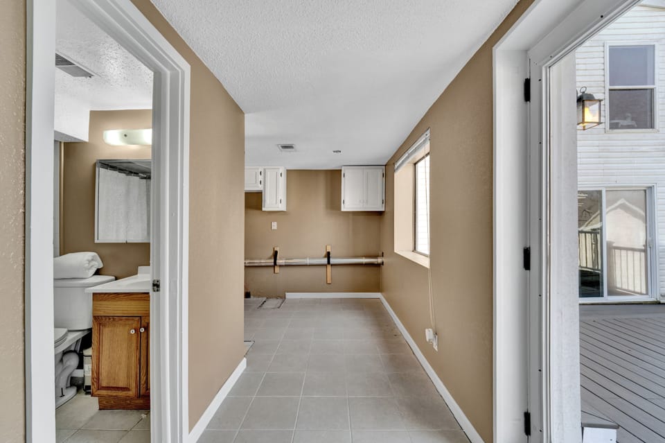Hall to lower level bathroom and laundry room