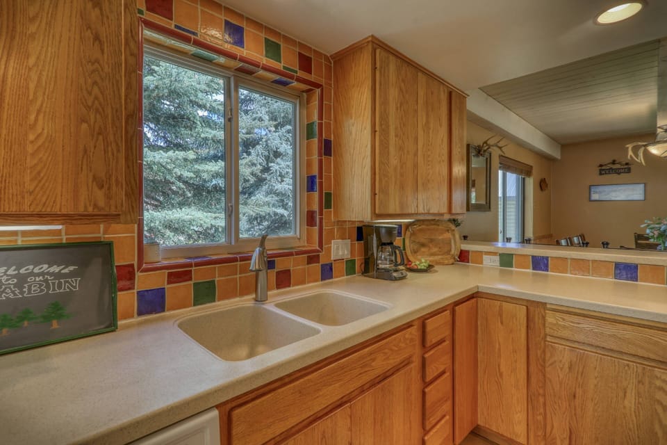 Beautiful, wooded view. This 4-bedroom 2 bath home is a true guest favorite. Riverfront, downtown, and privacy all in one lovely package.