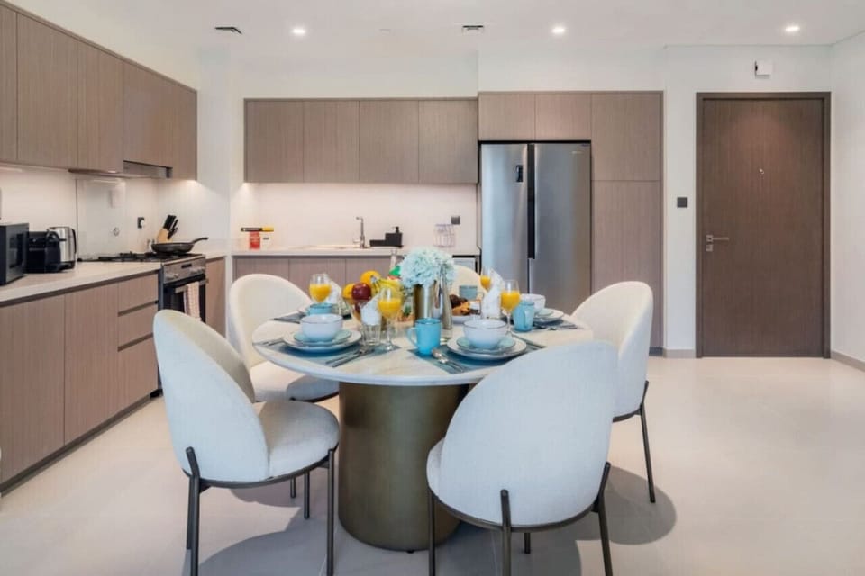 Dining Room: Elegant space to enjoy meals with a stunning table setting and modern decor!