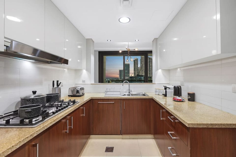 Gourmet Kitchen: Cook like a pro with sleek appliances and stunning skyline views!