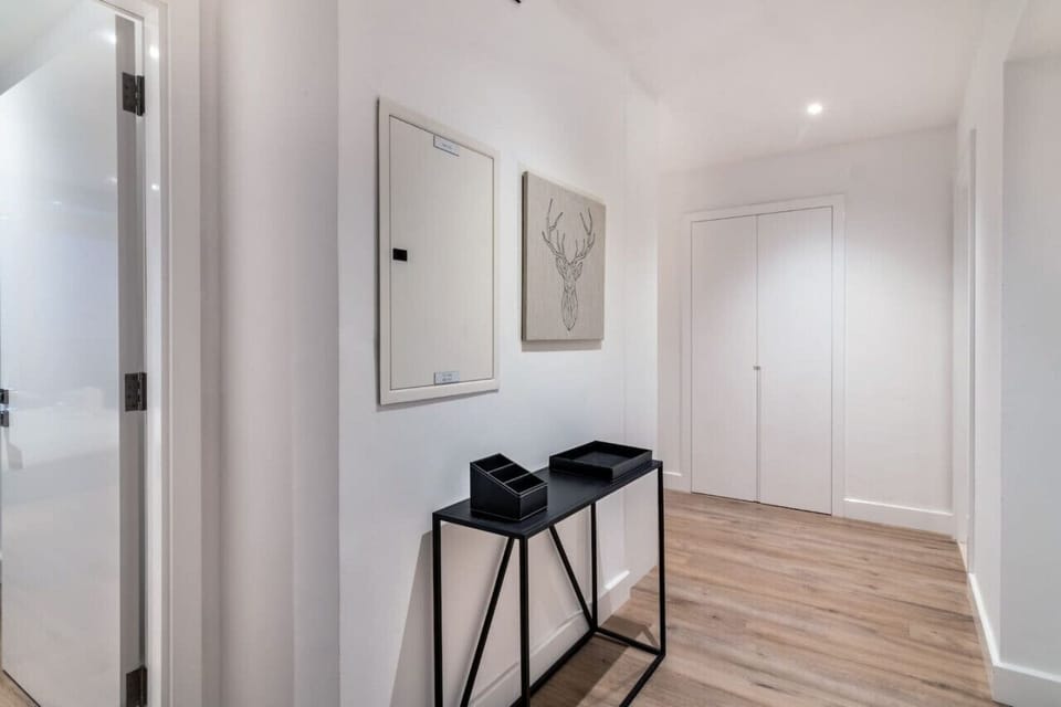 Entryway Escape: Stylish and bright entrance featuring modern decor and sleek furnishings!