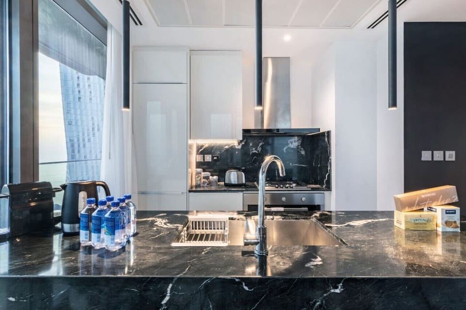 Modern Kitchen: Sleek marble countertops and stunning views make cooking a delight!