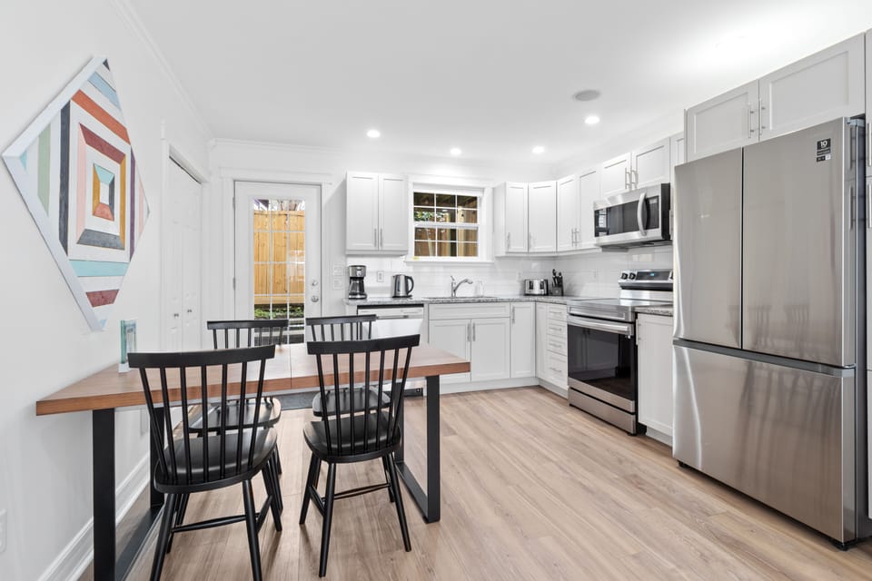 Gather and savor moments in this bright, open space—where a sleek kitchen meets a cozy dining nook!