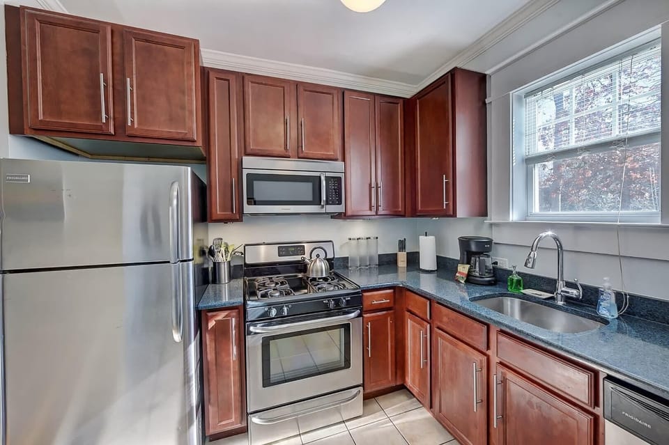 Fully equipped kitchen with wooden cabinets