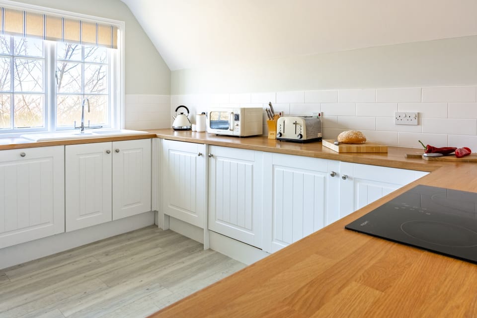 The kitchen is well equipped with ample counter space