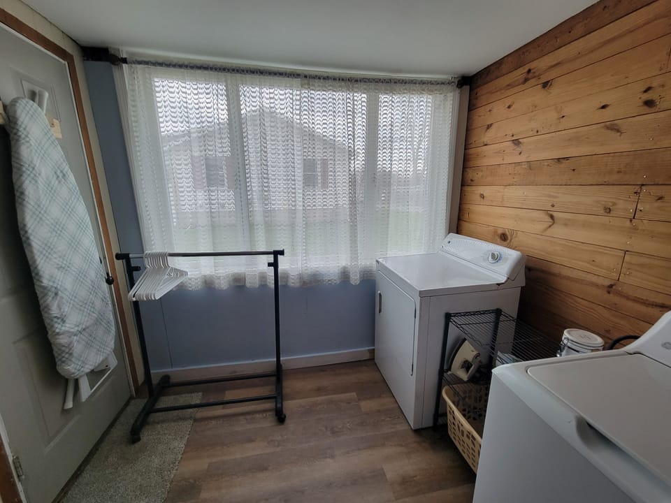 Full size washer, dryer,  iron & ironing board with All Free and Clear products.