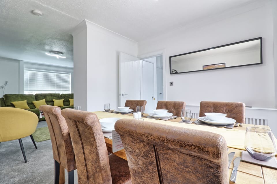 Dining table through to living room 