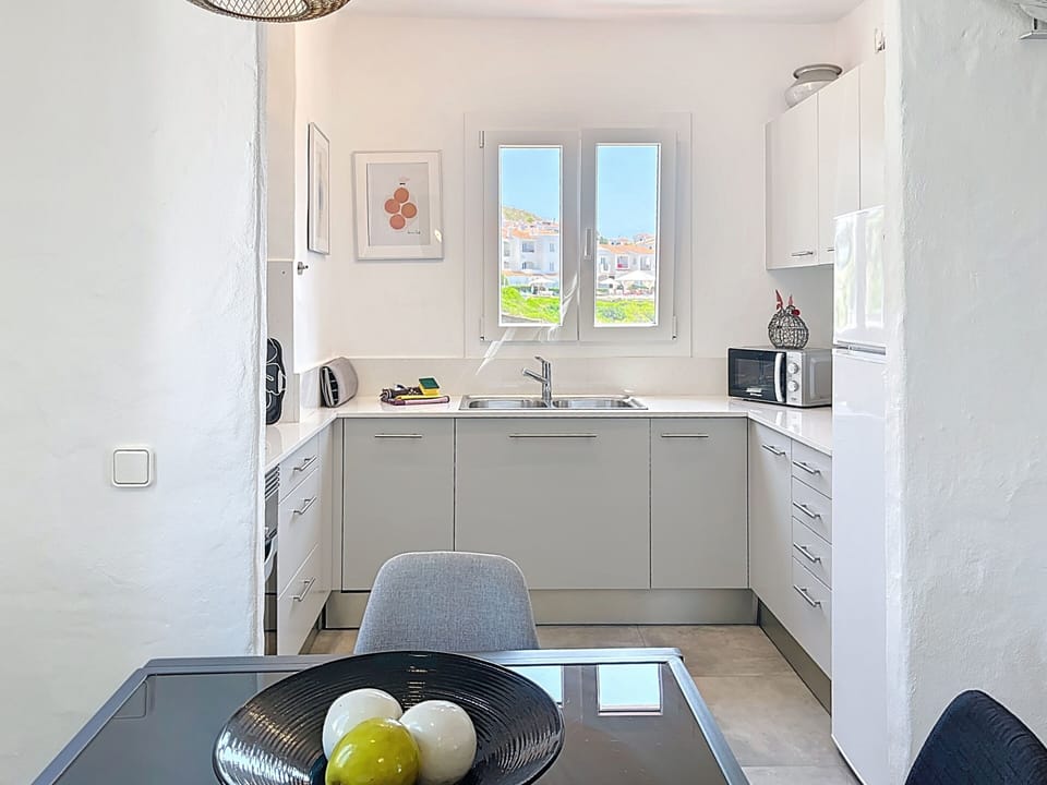 Dining room with access to a renovated, fully equipped kitchen.