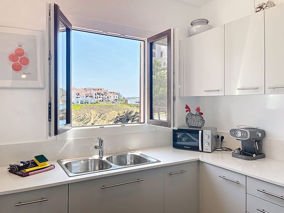 Modern kitchen, bright and fully equipped with stunning sea views