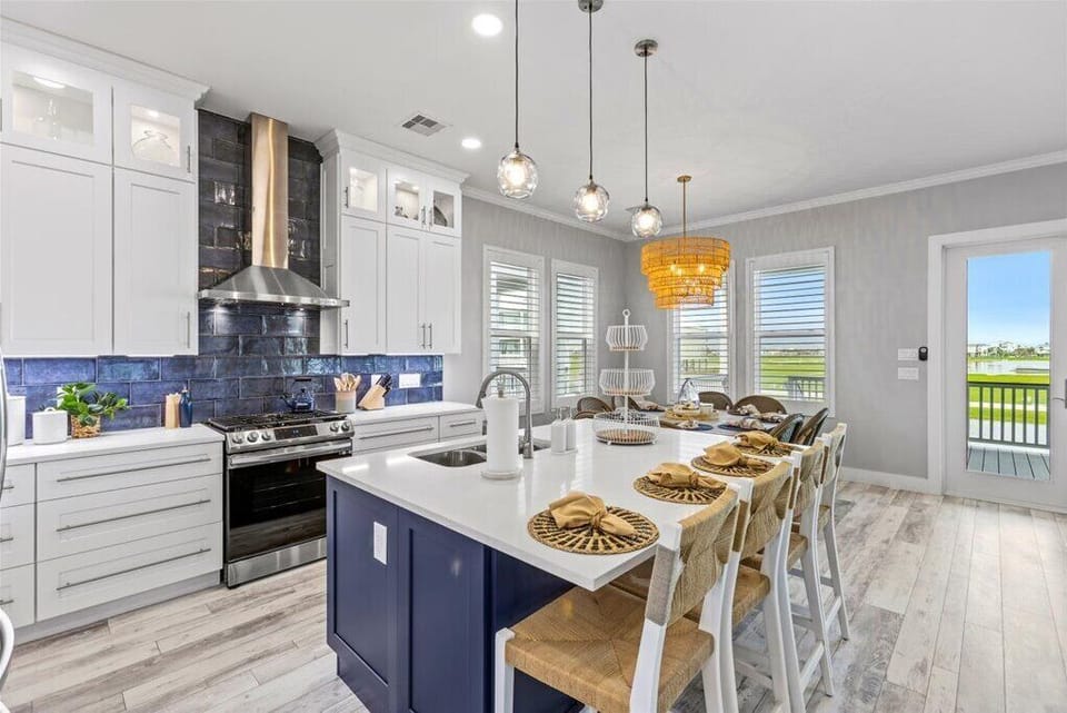 Stylish kitchen with stunning views, modern finishes, and ample seating for all!