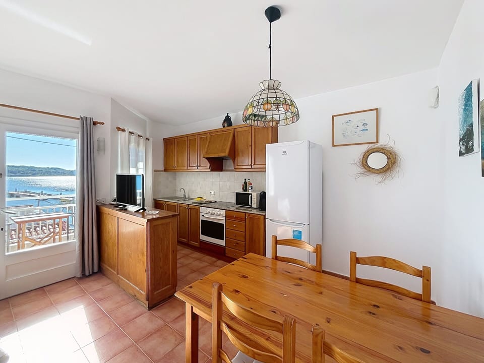 Dining room with sea views and open-plan kitchen