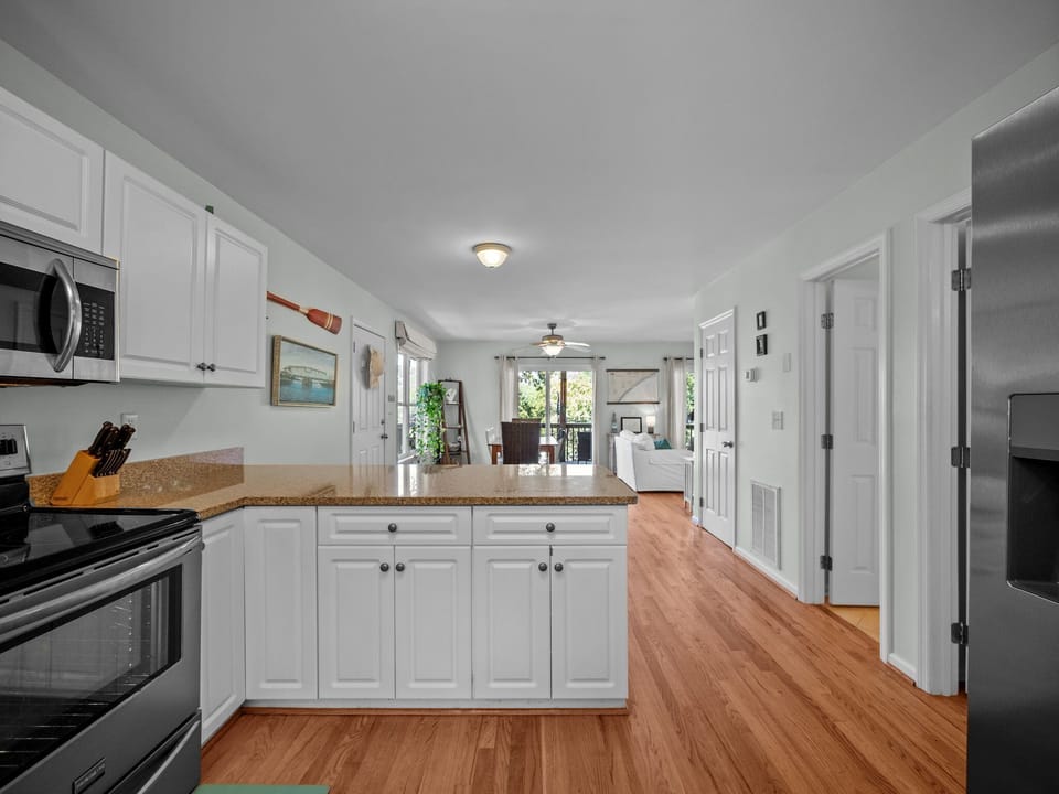 Primary bedroom/bath is located off of the kitchen on the right