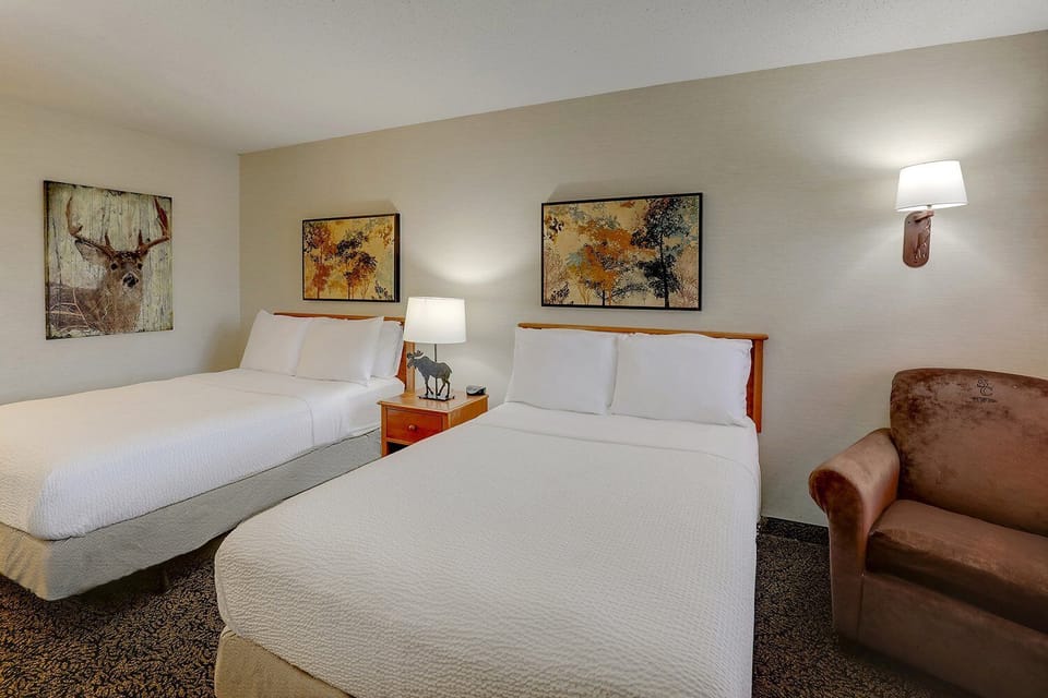 Drift off easily on crisp linens in a calm room.