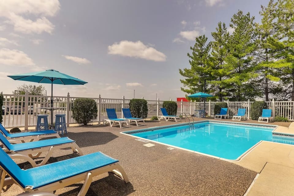 Bask poolside in the sun with loungers and umbrellas.
